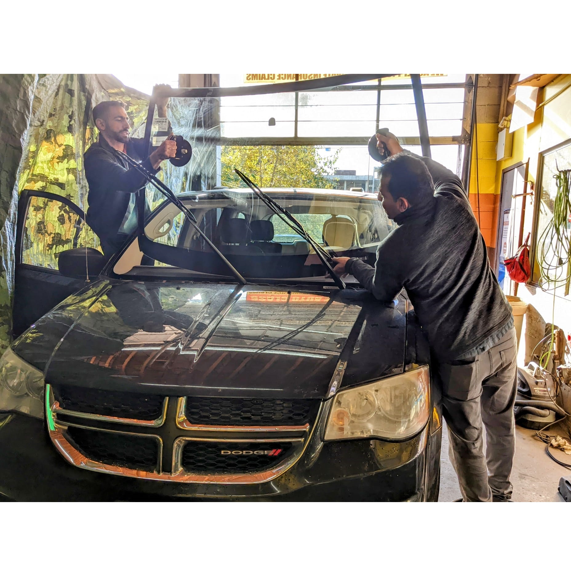 Professional windshield replacement in progress